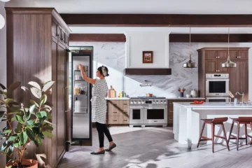 A woman enjoying her Signature Kitchen Suite appliances in Sacramento, CA