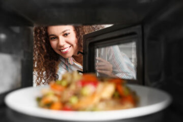 lady looking into oven