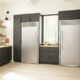 Image of single door Electrolux fridge and single door Electrolux freezer in a luxury kitchen.