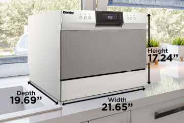 A compact dishwasher on a kitchen counter top.
