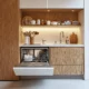 A small, modern kitchen with a dishwasher open.