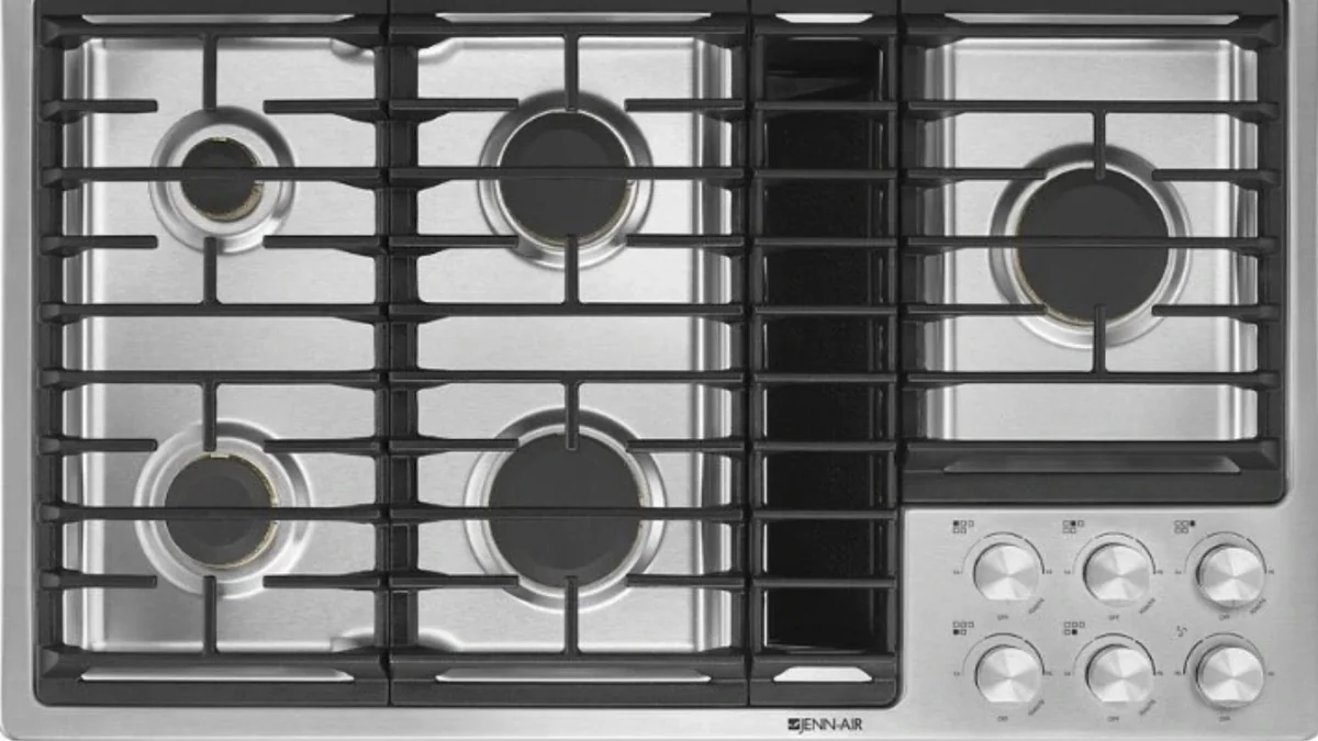 JennAir 36-inch gas downdraft cooktop with five burners and integrated ventilation system for open kitchen design