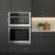 Electrolux ECWM3011AS 30-inch combo unit installed in modern kitchen with dark gray cabinets and white countertops