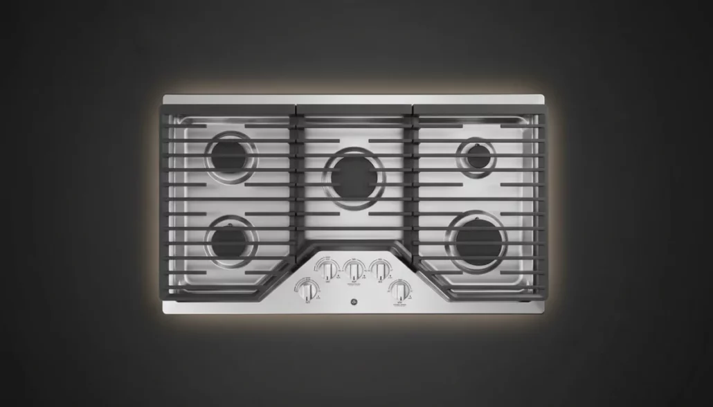 GE JGP5036SLSS 36-inch gas cooktop overhead view showing 5-burner configuration with continuous cast-iron grates