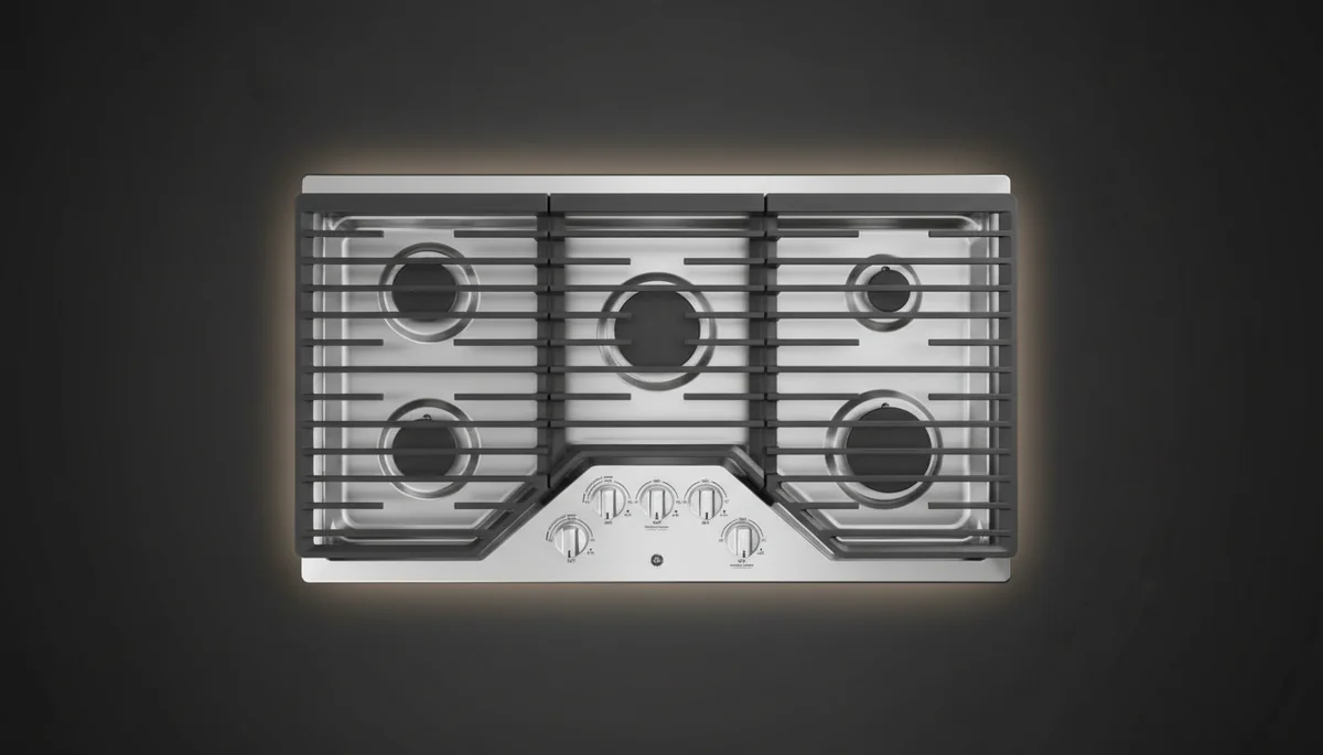 GE JGP5036SLSS 36-inch gas cooktop overhead view showing 5-burner configuration with continuous cast-iron grates