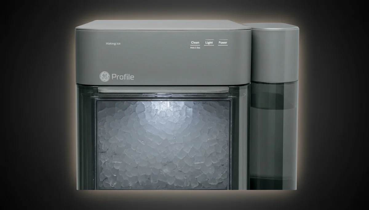 GE Profile Opal ice maker close-up showing premium chewable nugget ice pellets filling the transparent storage bin