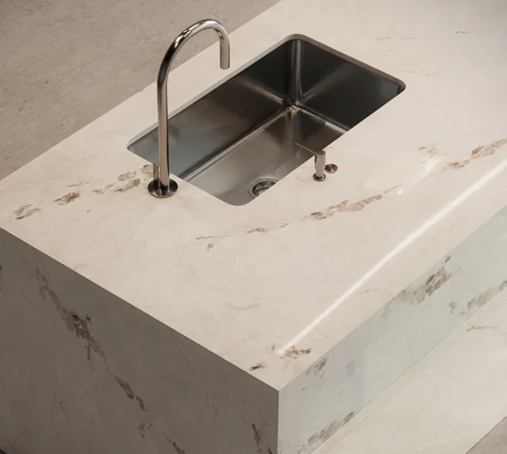 Sink and faucet set into a veined Dekton Bering countertop