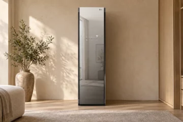 Mirrored LG S3MFBN Styler in a warm dressing room with plaster walls and pale oak cabinetry