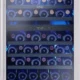 Zephyr Brisas BWN24C02AG wine cooler with wine bottles on black wire racks