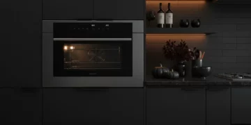 Wolf CSO30TM-S-TH 30-inch convection steam oven installed in dark modern luxury kitchen with warm accent lighting